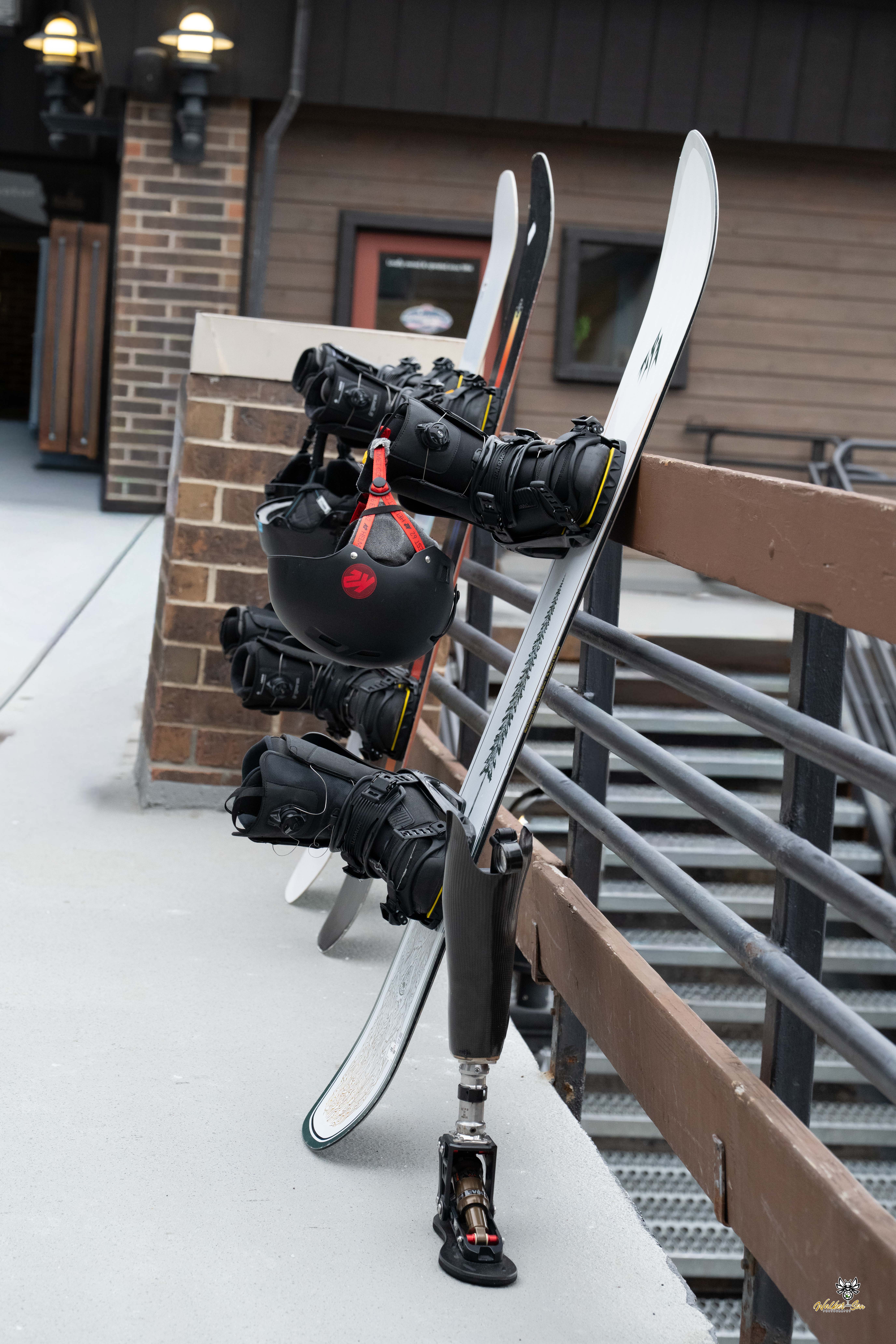Snowboards and prosthetic leg in the snow
